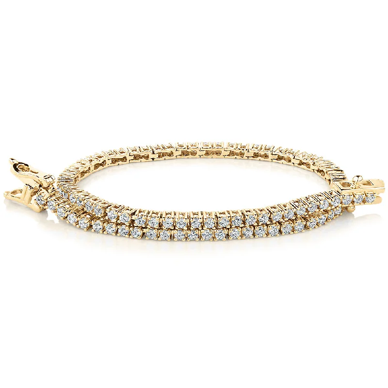 Round Brilliant tennis bracelet with 1.29 carats* of diamond simulants in 10 carat yellow gold