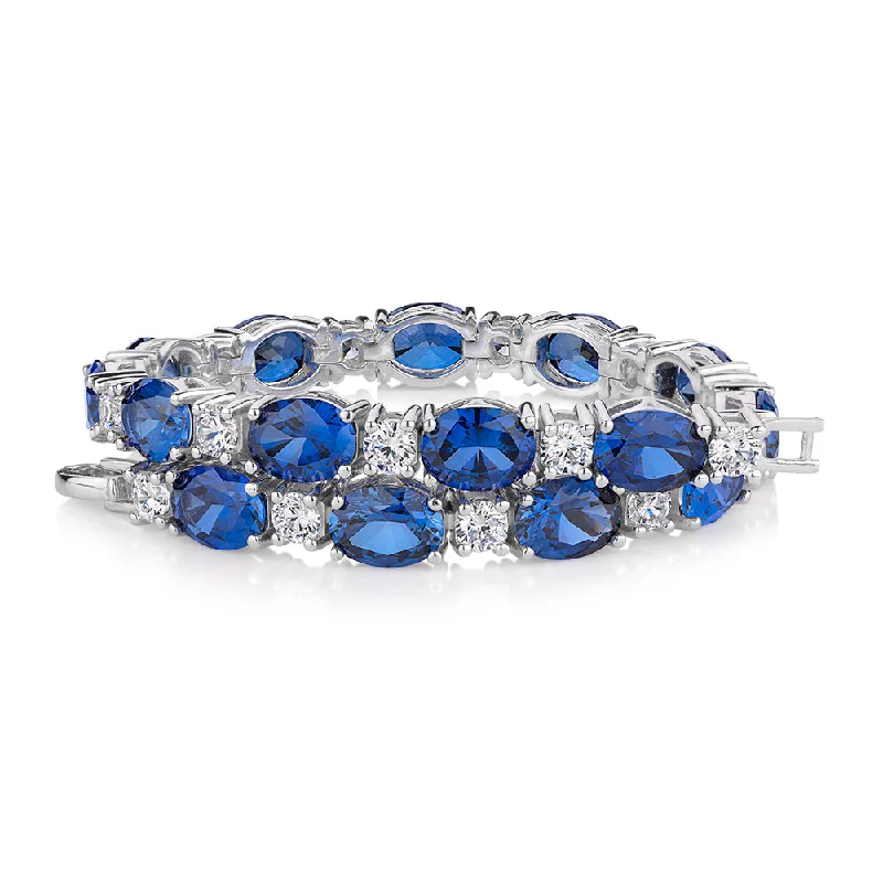 Oval and Round Brilliant tennis bracelet with sapphire simulants and 3.36 carats* of diamond simulants in sterling silver